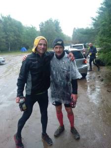 Peter Taylor with the yellow hood and I with the red socks and plastic at the finish!